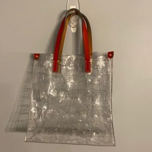Authentic Dooney and Bourke tote bag with red handle